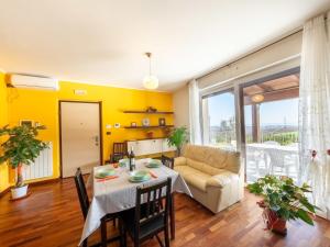 a living room with a table and a couch at Apartment Alba Marina by Interhome in Citta' Sant'Angelo