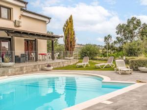 a swimming pool in the backyard of a house at Apartment Alba Marina by Interhome in Citta' Sant'Angelo