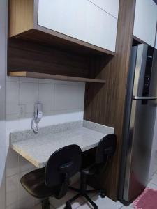 Kuchyň nebo kuchyňský kout v ubytování Apartamento mobiliado com ar condicionado em um quarto + 37 fotografií