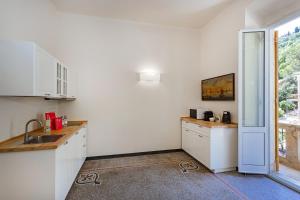 Η κουζίνα ή μικρή κουζίνα στο Freedom Apartment in Portofino by Wonderful Italy +11 φωτογραφίες