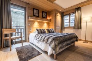 En eller flere senger på et rom på Aspen Lodge by Alpine Residences