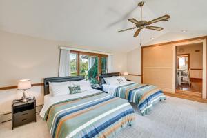 a bedroom with two beds and a ceiling fan at 5 Mi to Hersheypark Family Home with Game Room in Annville +23 photos