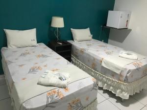 Postel nebo postele na pokoji v ubytování Lax Hotel - Acesso através de escadas - 3 andares