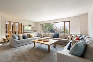 a living room with a couch and a table at Host & Stay - Crackin' View in Hexham +37 photos