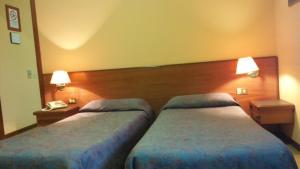 Ein Bett oder Betten in einem Zimmer der Unterkunft Hotel Due Fontane