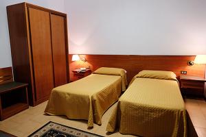 Ein Bett oder Betten in einem Zimmer der Unterkunft Hotel Due Fontane