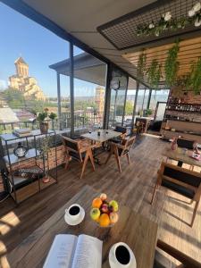 a room with a table with fruit on it at Hotel Livin in Tbilisi City