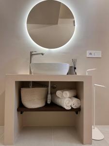 a bathroom with a sink and a mirror at Vireo Rooms in Santa Maria Navarrese +59 photos