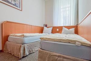 Postel nebo postele na pokoji v ubytování Villa Viktoria Whg 4 - "Kapitänskoje"