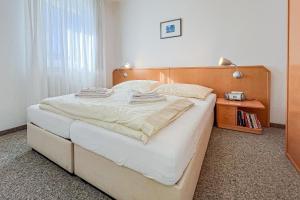 Postel nebo postele na pokoji v ubytování Villa Viktoria Whg 7 - "Wat Besünners" + 2 fotografie