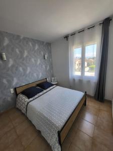 Postel nebo postele na pokoji v ubytování Maison chaleureuse
