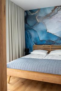 Ένα ή περισσότερα κρεβάτια σε δωμάτιο στο Apartament SEA FOAM DŹWIRZYNO