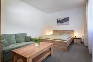 Una cama o camas en una habitación de Hotel Telgárt - Turistické ubytovanie