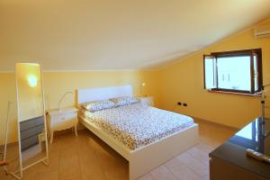 a bedroom with a bed and a window at Villa Motti Quadri in Arona +11 photos