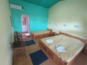 Postel nebo postele na pokoji v ubytování Sirius Guest House