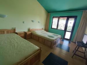 Postel nebo postele na pokoji v ubytování Sirius Guest House