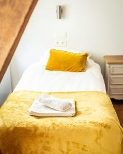 Postel nebo postele na pokoji v ubytování B&B La Ferme de l'Hosté