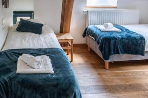Postel nebo postele na pokoji v ubytování B&B La Ferme de l'Hosté