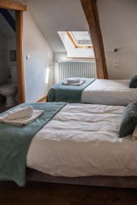 Postel nebo postele na pokoji v ubytování B&B La Ferme de l'Hosté