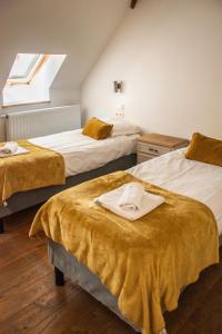 Postel nebo postele na pokoji v ubytování B&B La Ferme de l'Hosté