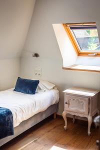 Postel nebo postele na pokoji v ubytování B&B La Ferme de l'Hosté