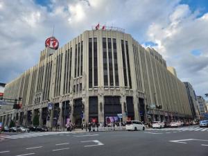 a large building with a clock on top of it at C3 Shinjuku center-4mins to room 10min to Kabukicho-新宿商圈Loftoom in Tokyo