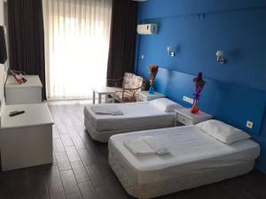 Postel nebo postele na pokoji v ubytování Hancı apart + 2 fotografie