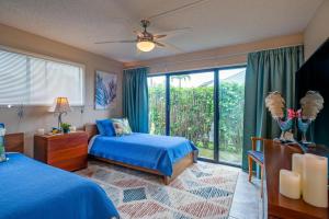 En eller flere senge i et værelse på Kamahana 23 + 23 billeder