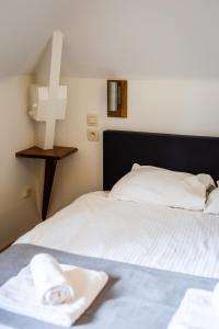 Postel nebo postele na pokoji v ubytování B&B La Ferme de l'Hosté