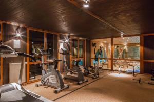 a gym with several treadmills and elliptical machines at Résidence Les Balcons de Belle Plagne in Belle Plagne