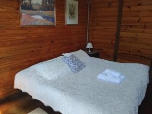 En eller flere senge i et værelse på Pousada Florada na Serra - Apto 2