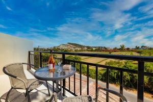 a table and chairs on a balcony with a view at Ionian Serenity House in Zakynthos