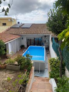 a house with a swimming pool in the yard at Casa con terraza, piscina y zona barbacoa in Montrás