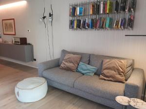 a living room with a couch and a table at Dervio Casa Max in Dervio