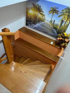 a view from the top of a staircase with a picture on the wall at Apartma Mimi in Dekani +27 photos