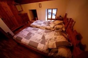 Katil atau katil-katil dalam bilik di Ferrata Vacanze