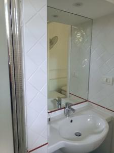 a bathroom with a sink and a mirror at Il Giardino nell'Orto in Vetralla +48 photos