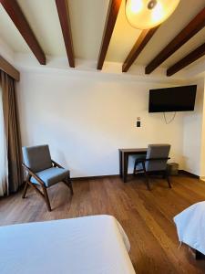 TV a/nebo společenská místnost v ubytování Hotel Casa Rubio