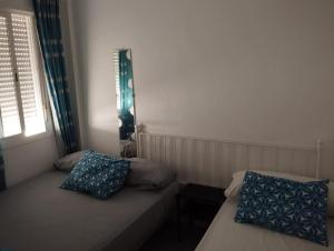 Postel nebo postele na pokoji v ubytování Piso Conil de la Frontera + 7 fotografií