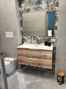 a bathroom with a sink and a toilet at B&B Carpe Diem 2 in Caserta
