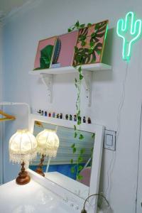 a room with two lamps and a shelf on the wall at Light house hongdae Open sale in Seoul