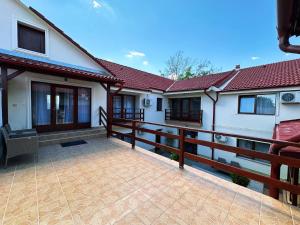 a patio of a house with a fence at DorTin in Arad