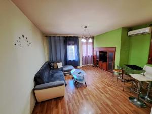 a living room with a couch and a table at relax in Plovdiv