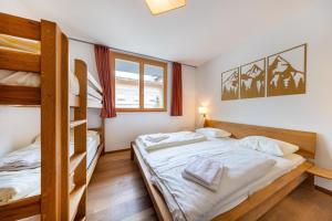 Postel nebo postele na pokoji v ubytování Residenz Wildkogelbahnen Top 5