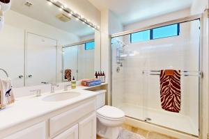 a bathroom with a sink toilet and a shower at Riviera Manor Permit# 68147 in La Quinta +14 photos