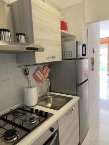 Η κουζίνα ή μικρή κουζίνα στο Casa Vacanze Quartu Sant'Elena