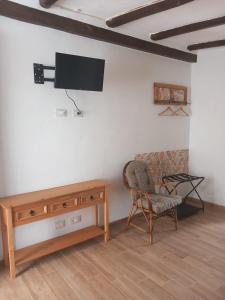 TV a/nebo společenská místnost v ubytování Il Poggio