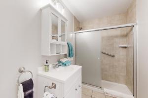 a bathroom with a white sink and a shower at Heartwood Manor in Asheville +19 photos