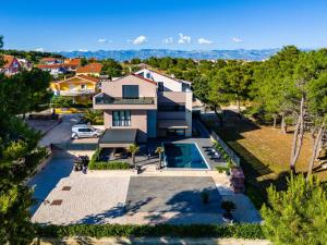 an aerial view of a house with a swimming pool at Apartments Royal in Vir