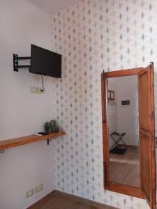 TV a/nebo společenská místnost v ubytování Il Poggio